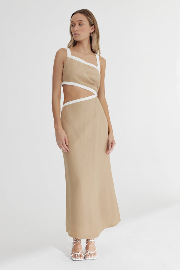 A model stands against a white background wearing Significant Other's Elena Midi Dress in Sand.